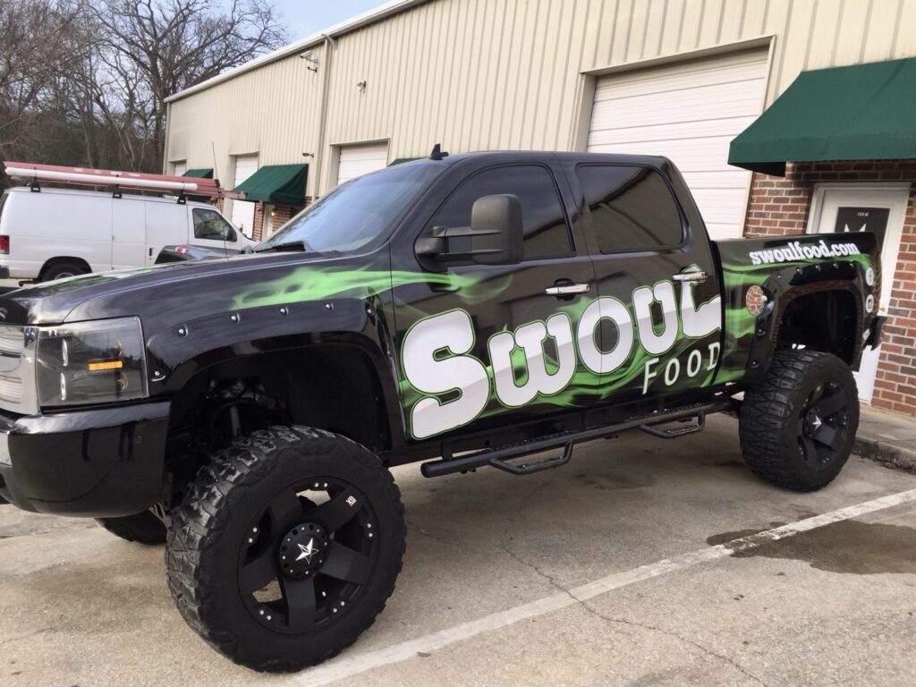 Vehicle wraps Birmingham AL: Swoul Food custom wrap on a lifted Chevrolet Silverado by Black Diamond Designs