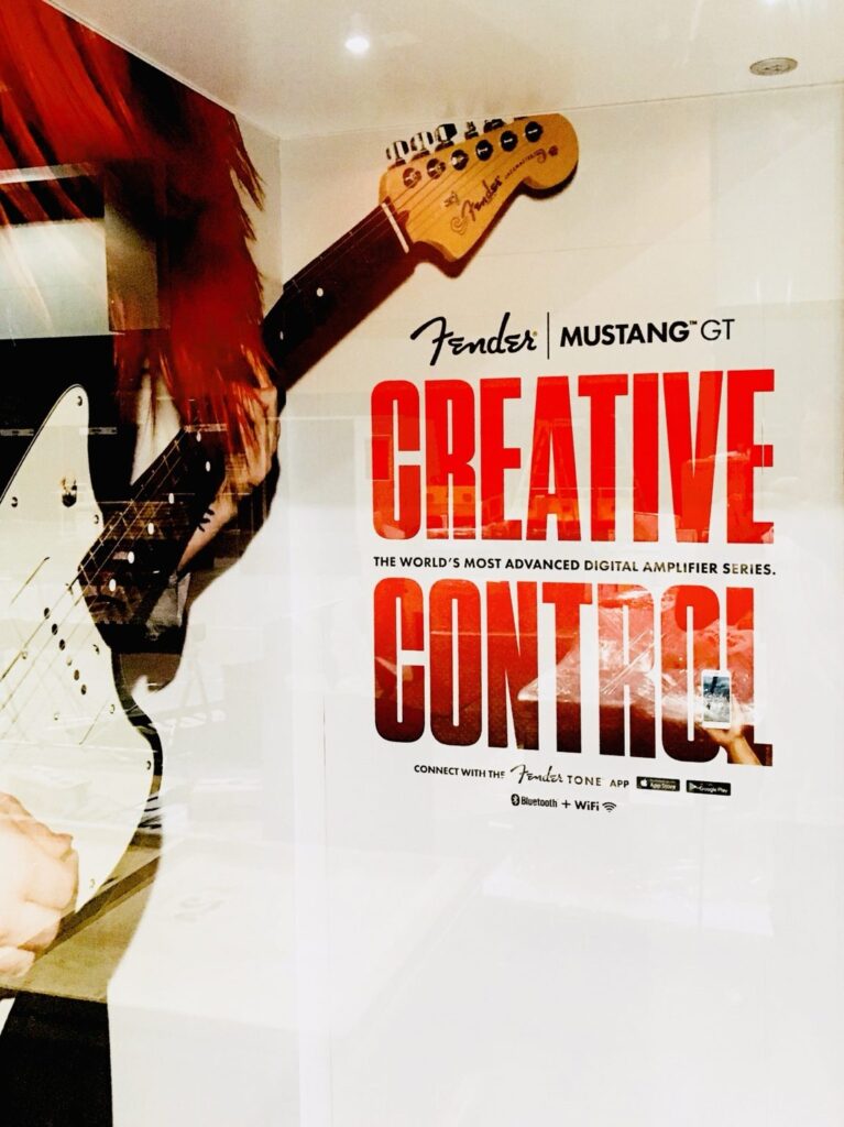 Fender Mustang GT “Creative Control” promotional graphic installed inside the Fender trade show booth.