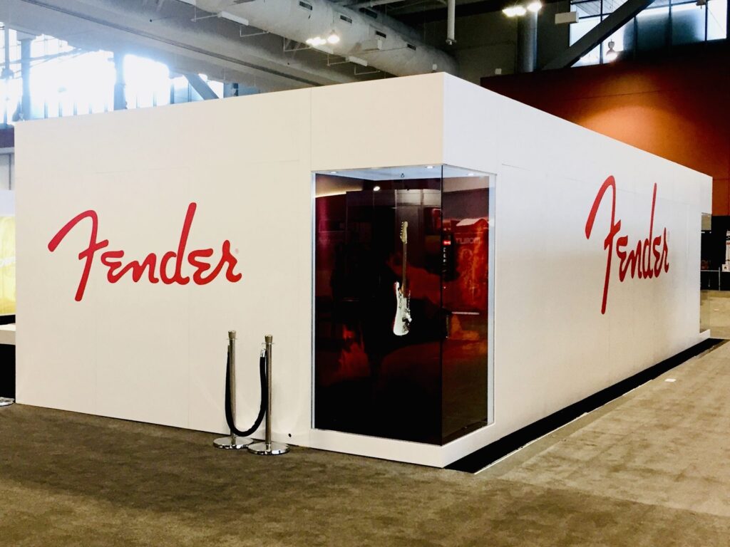 Nashville trade show graphics: white Fender booth with red Fender script logos at Music City Center, July 2017.