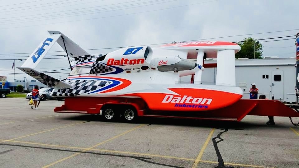 Wrapped U-27 Dalton Industries unlimited hydroplane on its trailer, showing the side graphics and U-27 tail fin.