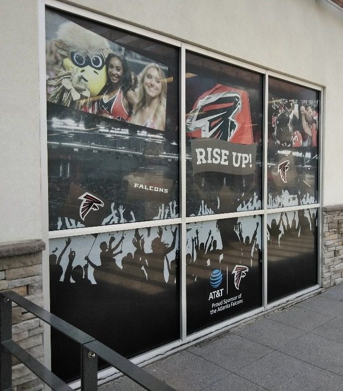 Angled view of Atlanta Falcons and AT&T multi-panel commercial window graphics installation in metro Atlanta, Georgia.