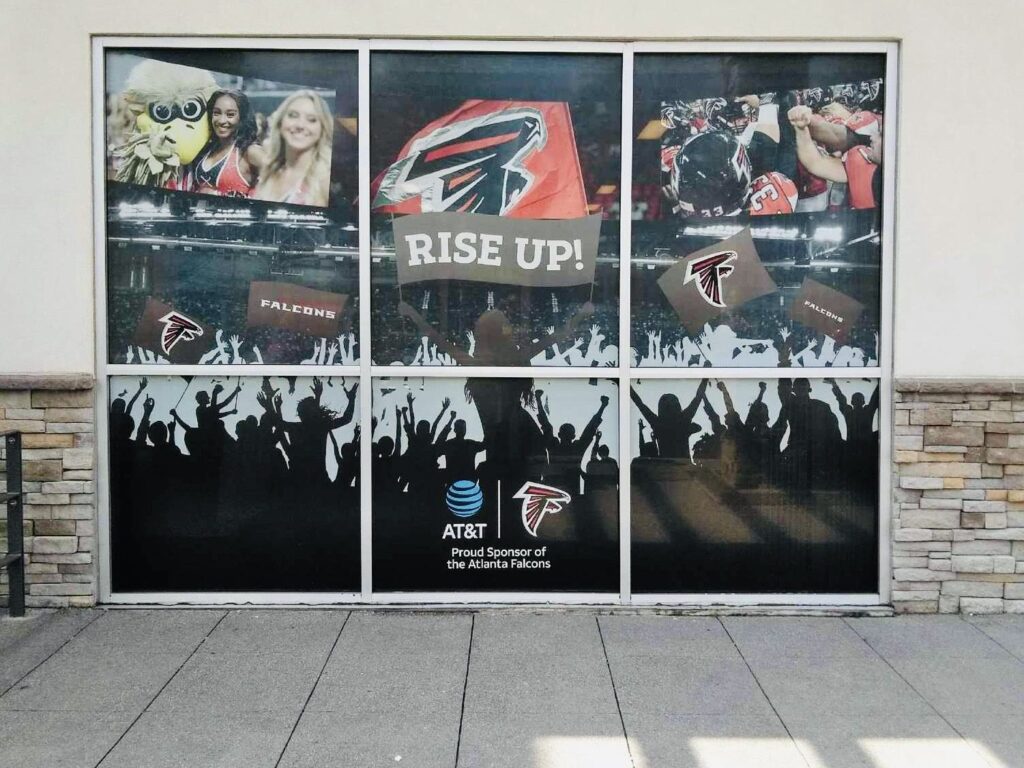 Atlanta Falcons and AT&T RISE UP perforated storefront window graphics installed by Black Diamond Designs in Atlanta, September 2017.
