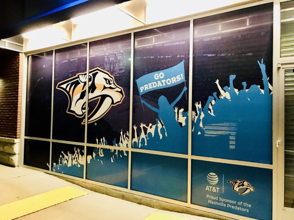 Close view of Nashville window graphics showing Predators logo, crowd silhouettes, GO PREDATORS banner, and AT&T sponsor lockup.