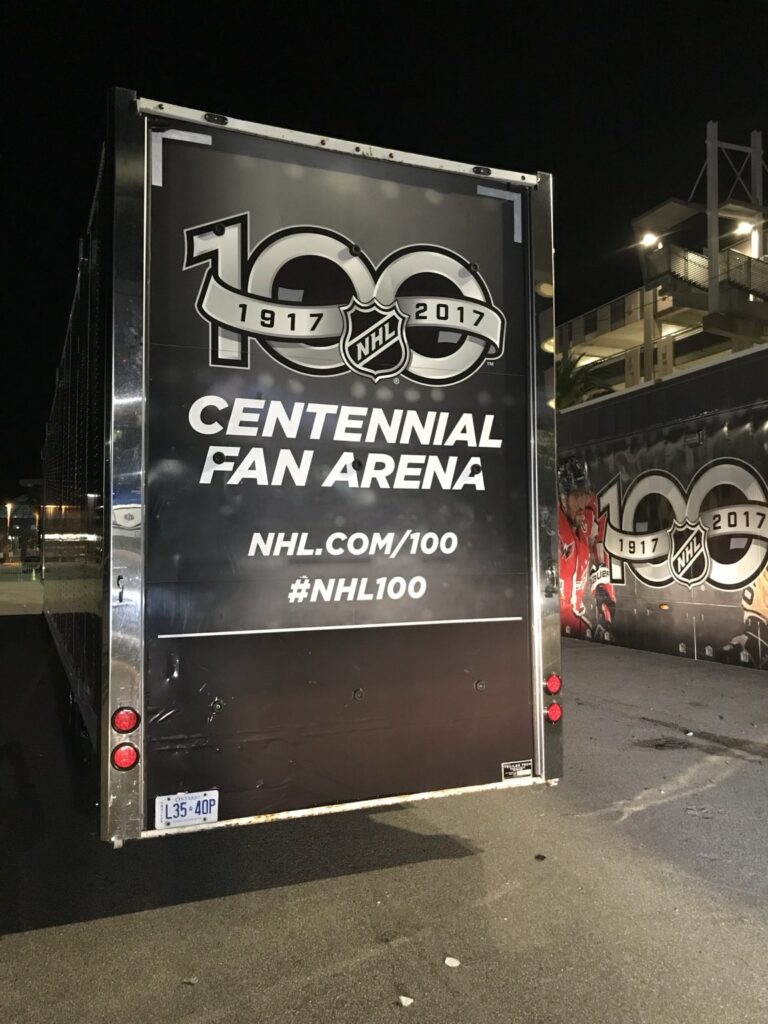 Rear trailer doors displaying NHL 100th anniversary 1917–2017 Centennial Fan Arena logo and NHL.com/100 messaging