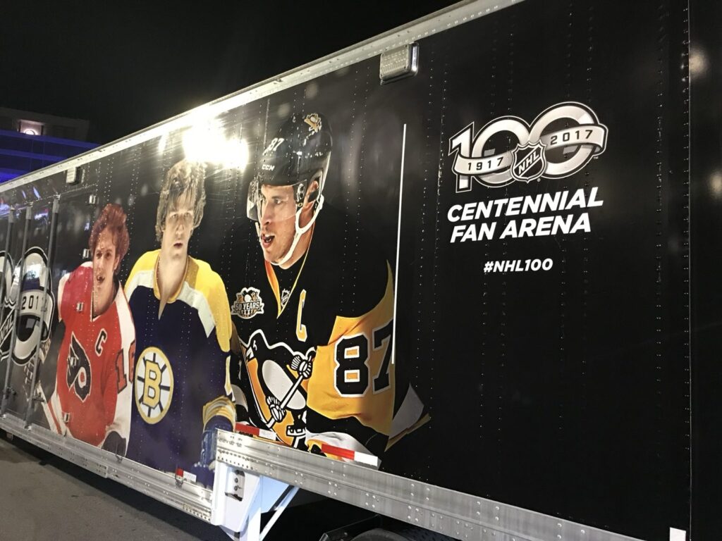 NHL Centennial trailer graphics showing historic hockey players and a large NHL 100 Centennial Fan Arena logo