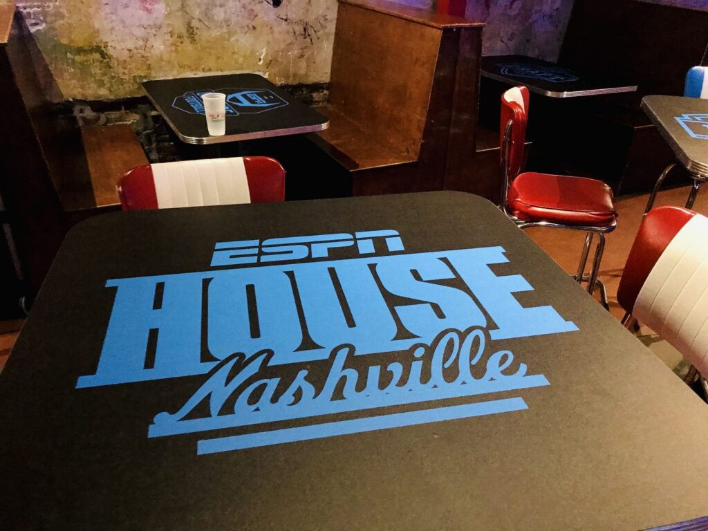 ESPN House Nashville logo graphics on bar table tops.