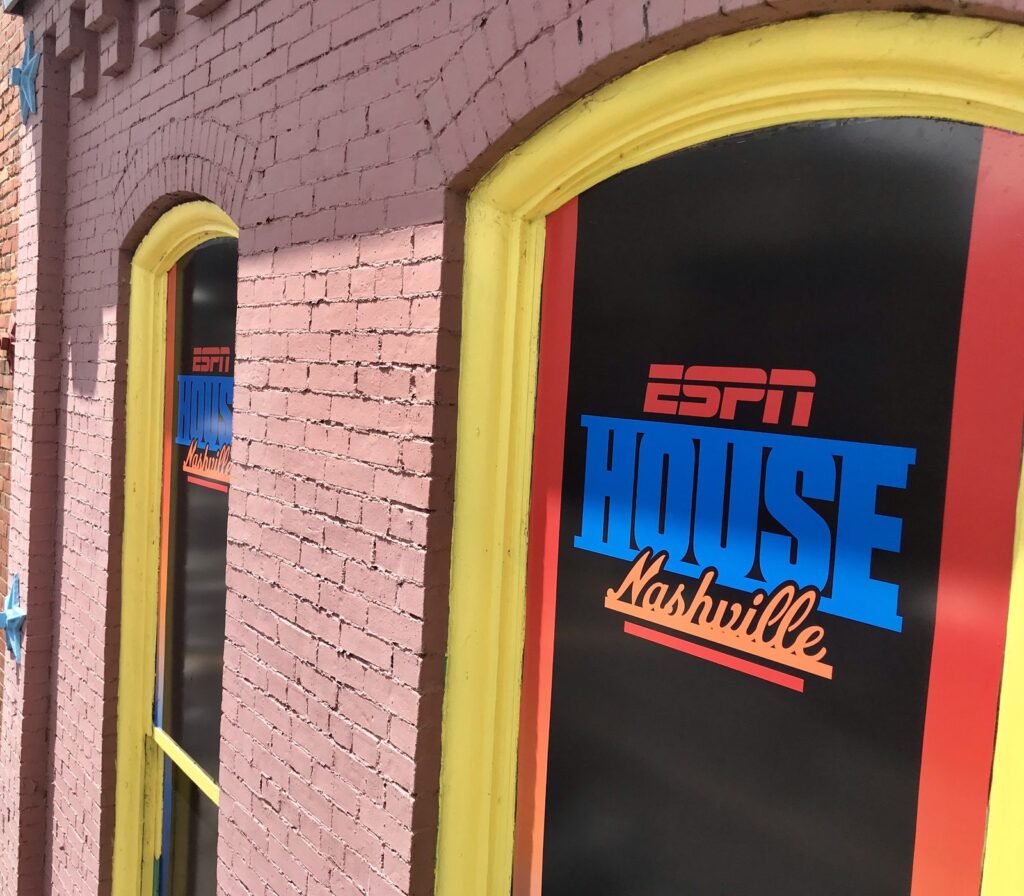 Nashville graphics installation: ESPN House Nashville window graphics on a pink brick building for the 2019 NFL Draft.