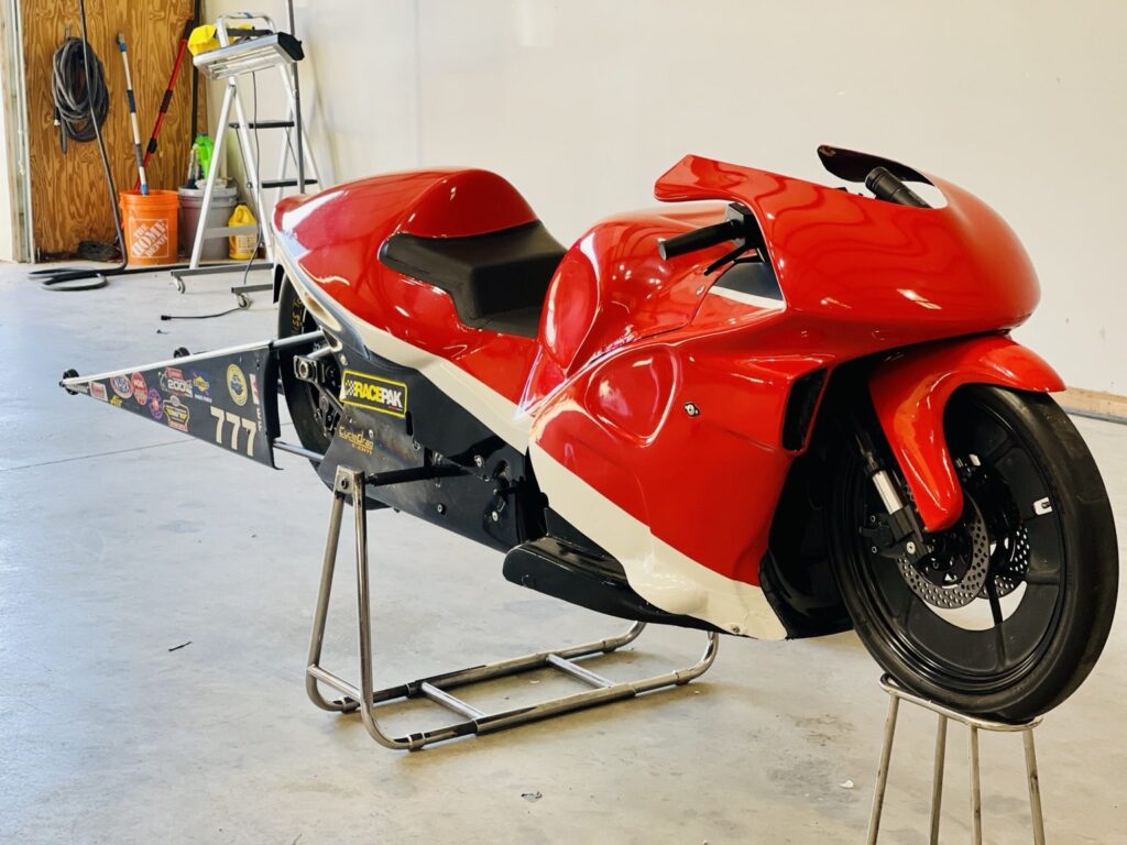 Karen Stoffer drag bike wrap: red and white drag racing motorcycle after graphics installation in Alabaster, Alabama