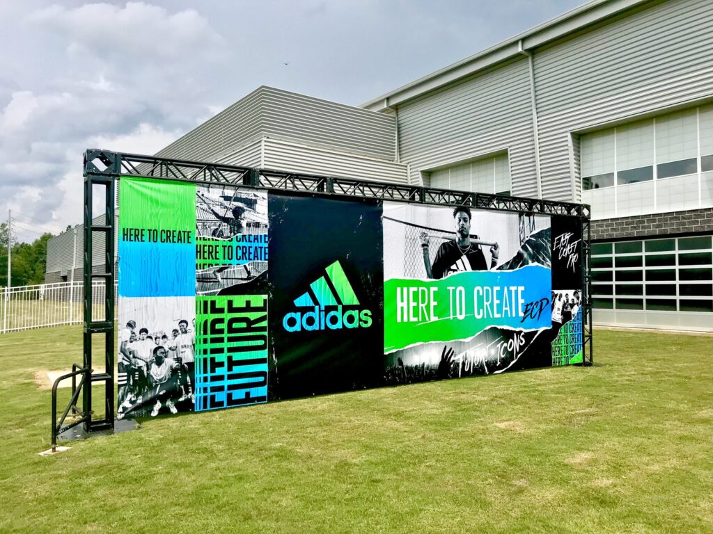 Large-format Adidas Here to Create vinyl banner on a freestanding exterior truss at the Hoover Met Complex.