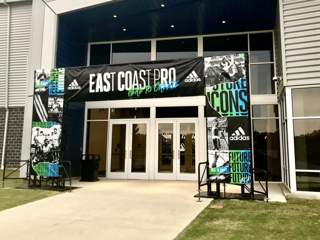 Sports event graphics installation: East Coast Pro entrance banner with Adidas branding at the Hoover Met Complex in Hoover, Alabama.