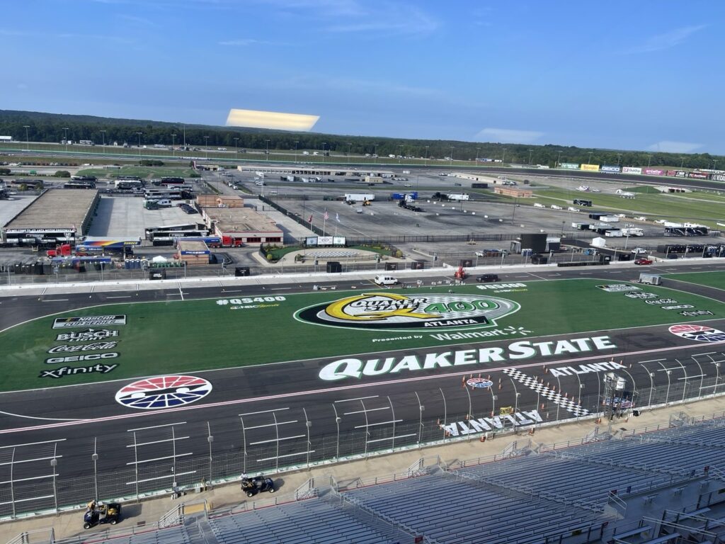 Elevated view of Atlanta Motor Speedway with Quaker State 400 logo on the infield grass, NASCAR sponsor marks and grandstands