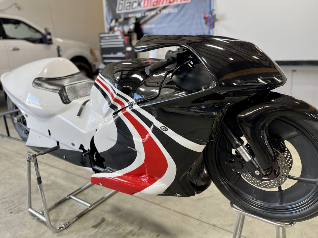 Front three-quarter view of the WAR Motorsports drag bike custom printed fairing graphics