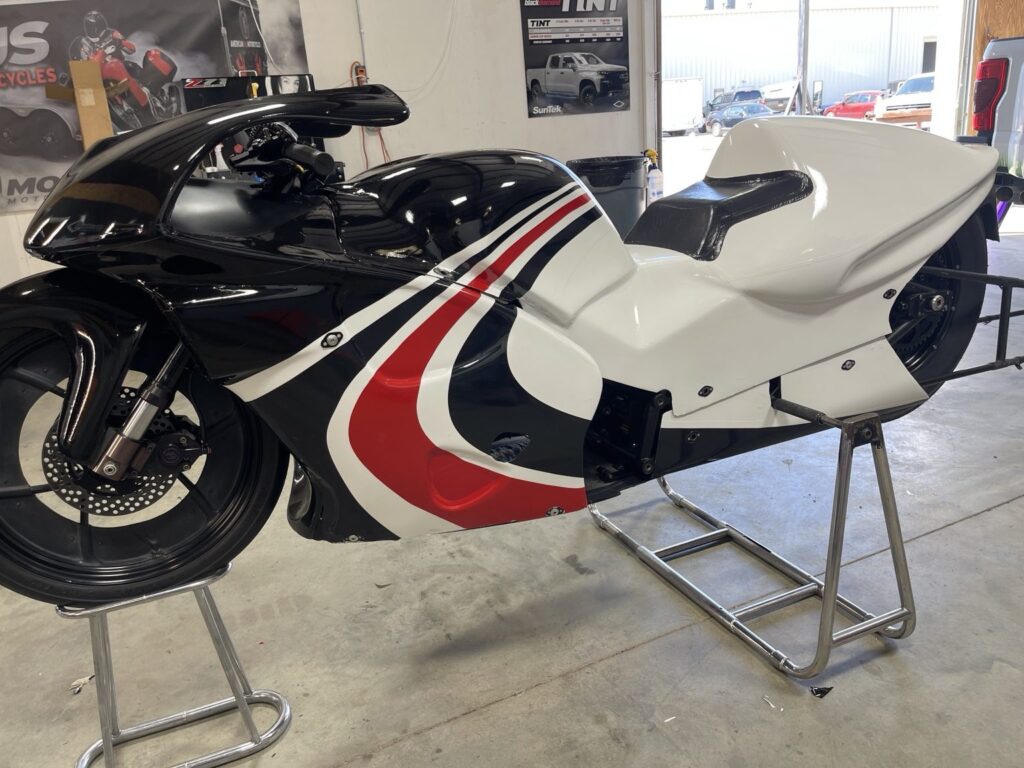 WAR Motorsports drag bike graphics: side view of the drag bike in black, white and red custom graphics