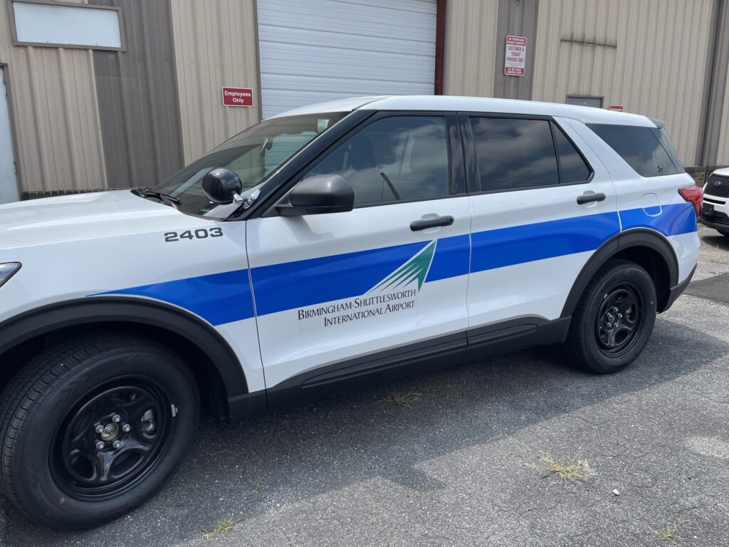 Airport patrol vehicle graphics Birmingham: completed patrol SUV with reflective blue fleet graphics