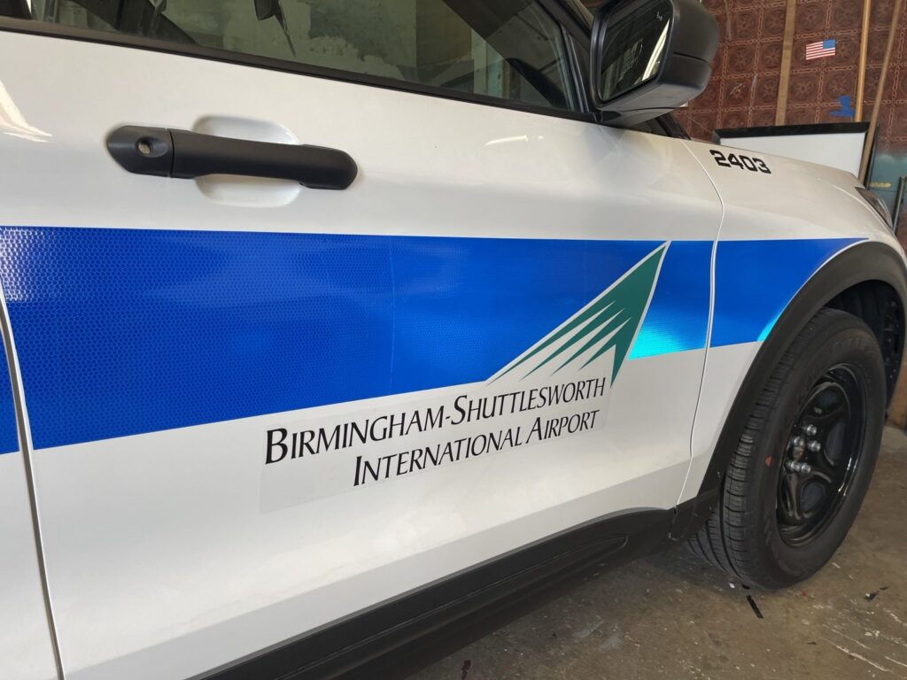 Close-up of the reflective stripe and Birmingham-Shuttlesworth International Airport identification