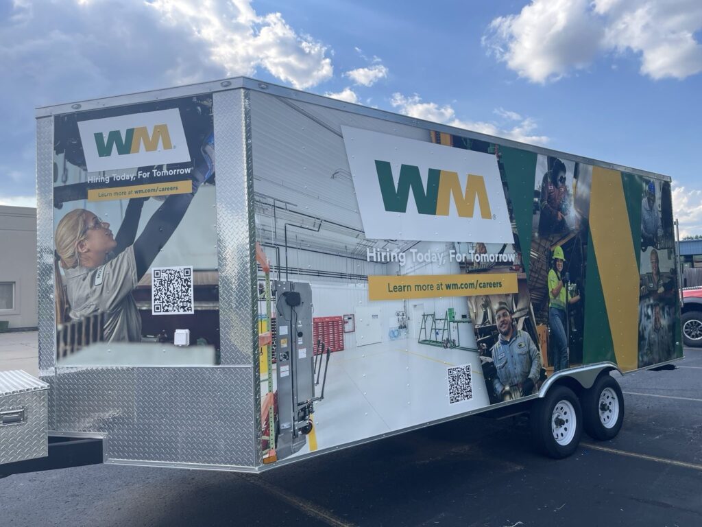Cargo trailer graphics featuring WM employees and corporate branding