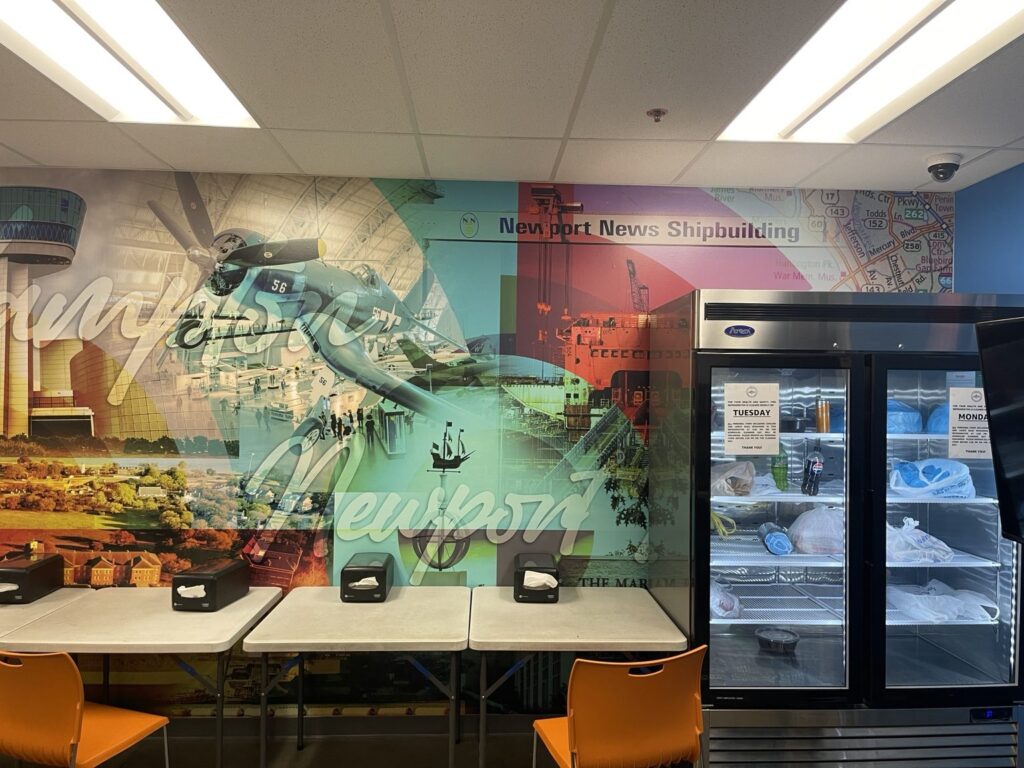 Shipbuilding-themed wall graphics in an employee space