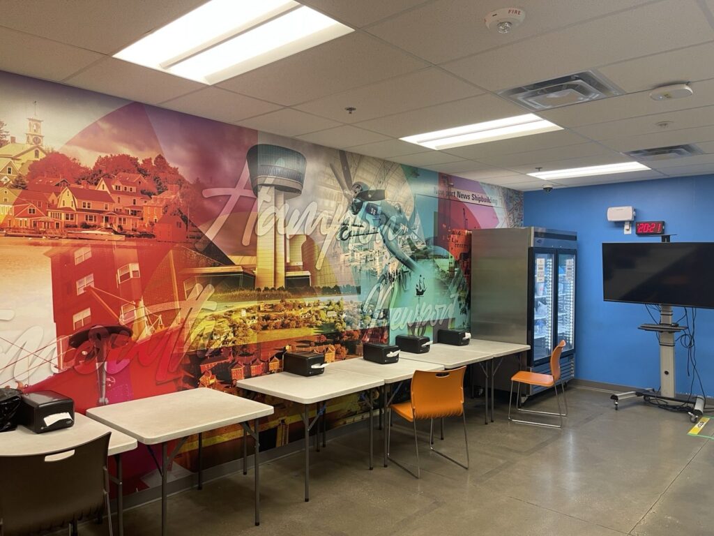 Wide interior view of a Virginia regional mural in an employee break room