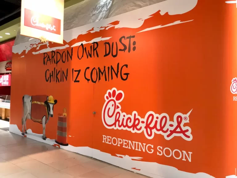 Chick-fil-A grand reopening barricade graphics installed by Black Diamond Designs.