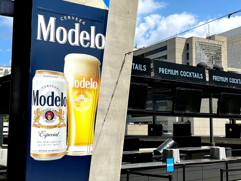 Cerveza Modelo column wrap at a stadium concourse bar by Black Diamond Designs, 3M graphics installer Atlanta and Birmingham