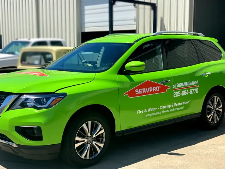 SERVPRO branding on a green SUV