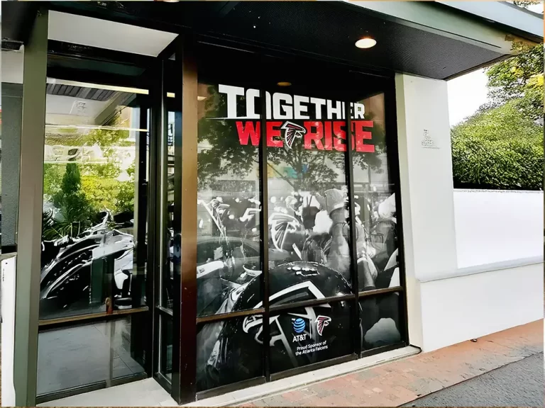 Atlanta Falcons Together We Rise window graphics at a storefront