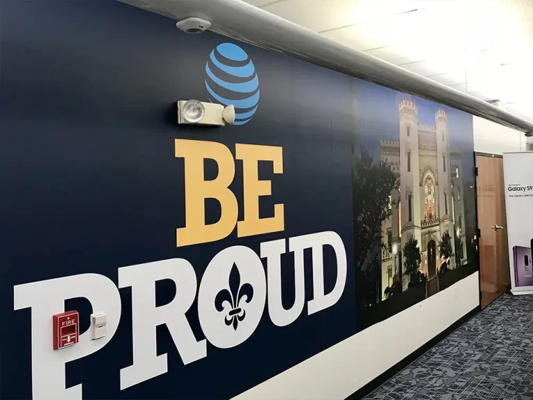 AT&T Be Proud wall graphic in a corporate interior