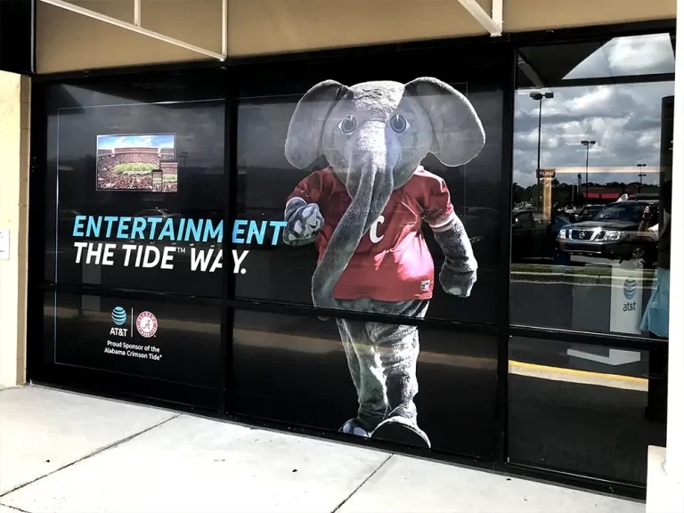 Crimson Tide elephant mascot graphics across AT&T storefront windows