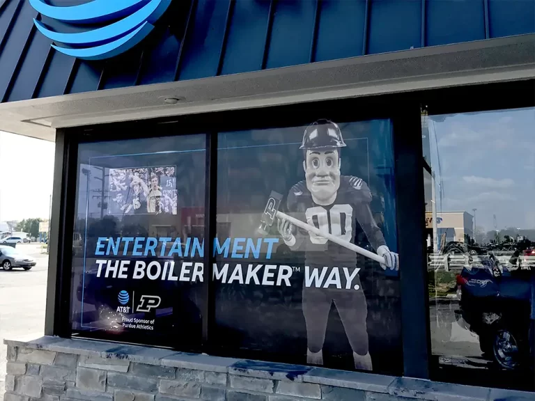 AT&T storefront window graphics reading Entertainment the Boilermaker Way