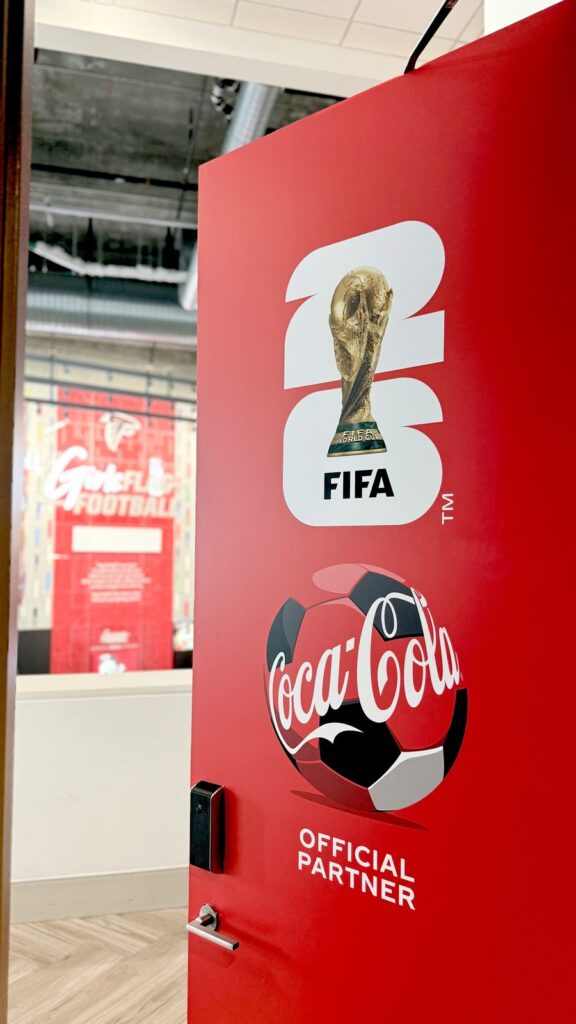 Coca-Cola FIFA World Cup 2026 door graphics installation at Mercedes-Benz Stadium in Atlanta by Black Diamond Designs.