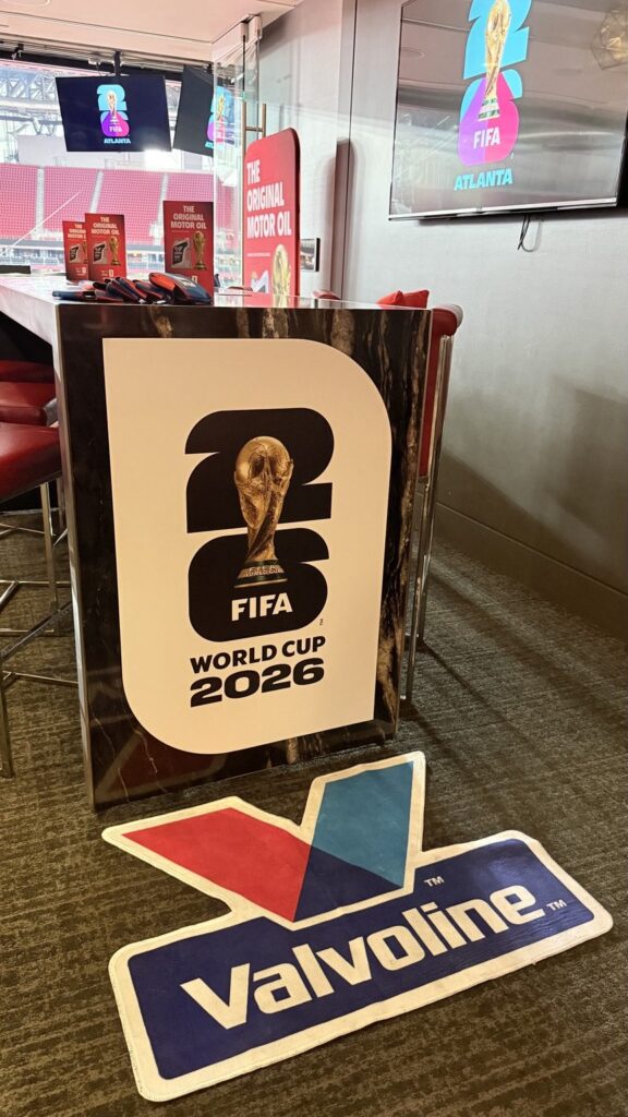 FIFA World Cup 2026 bar panel and Valvoline floor graphic inside a Mercedes-Benz Stadium suite