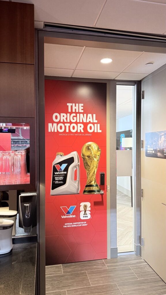 Valvoline World Cup suite graphics: full-height The Original Motor Oil door graphic with FIFA World Cup 2026 branding at Mercedes-Benz Stadium