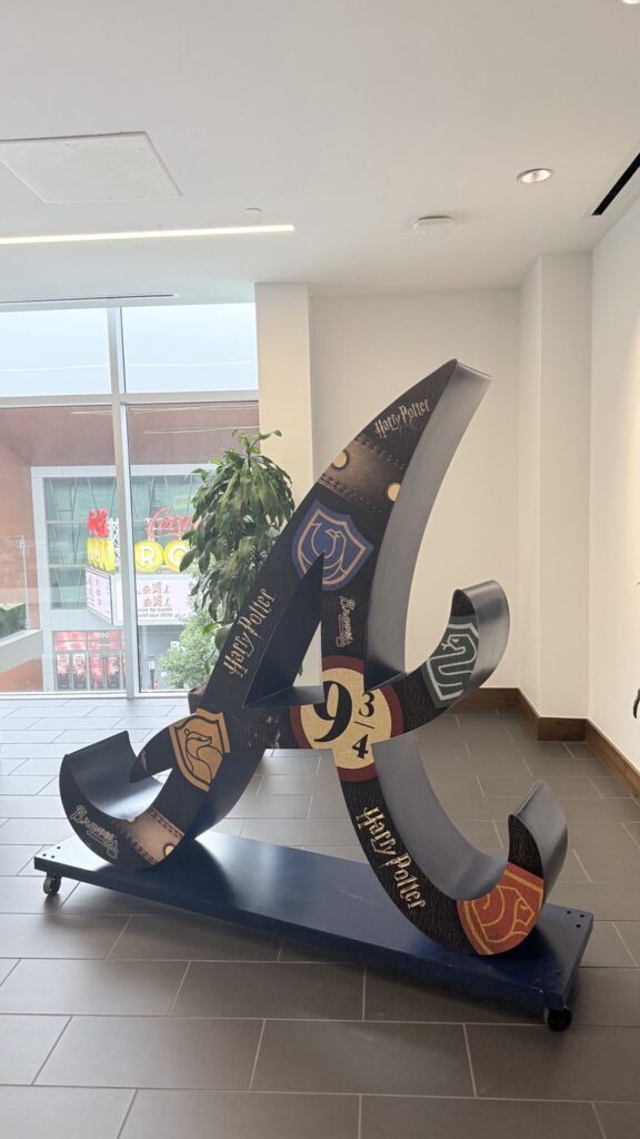 Side view of the Harry Potter themed Braves sculpture showing curved edges and vinyl graphics