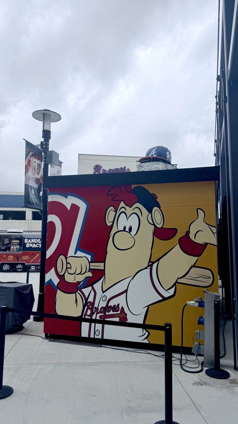 Large-format Blooper mascot graphics on the Blooper's Clubhouse store exterior at Truist Park.