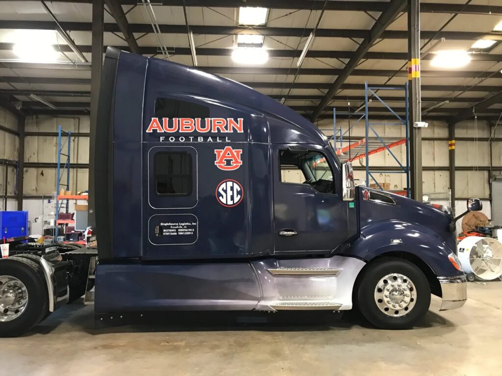 Side view of Auburn Football semi-truck sleeper cab with AU and SEC graphics