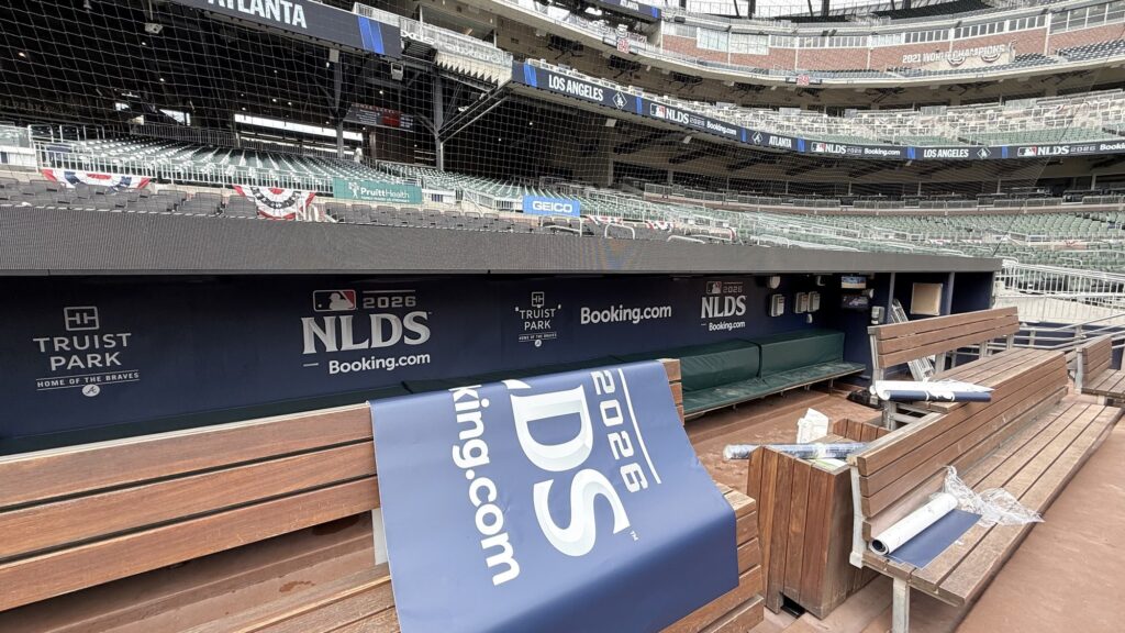 Atlanta Braves dugout with 2026 NLDS and Truist Park graphics installed by Black Diamond Designs