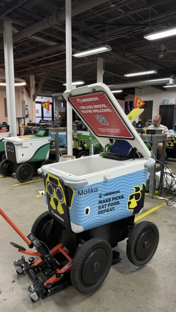 UNDERDOG delivery robot wrap with Malika on the side panel, installed by Black Diamond Designs.